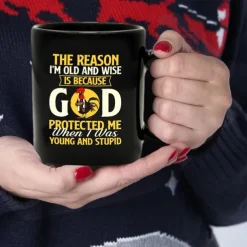 Funny Coffee Mug - The Reason I'm Old and Wise Is Because God Protected Me, Black Ceramic 11oz Cup, Sarcastic Gift for Dad, Grandpa, Friends, and Coworkers
