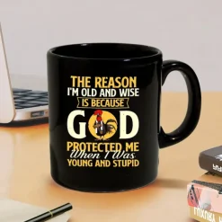Funny Coffee Mug - The Reason I'm Old and Wise Is Because God Protected Me, Black Ceramic 11oz Cup, Sarcastic Gift for Dad, Grandpa, Friends, and Coworkers