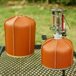 1pc Outdoor Camping Flat Gas Cylinder Leather Cover, Durable Protective Case, Weather-Resistant, Stylish and Practical, Safeguards Gas Cylinder from Scratches and Damage, Ideal for Outdoor Camping and Picnics